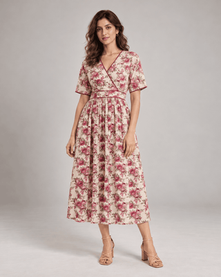 Woman wearing Vintage Rose beige floral cotton wrap midi dress with maroon lace piping, front view